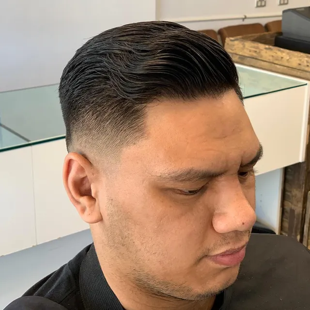 Classic dark side-part cut at Golden Four