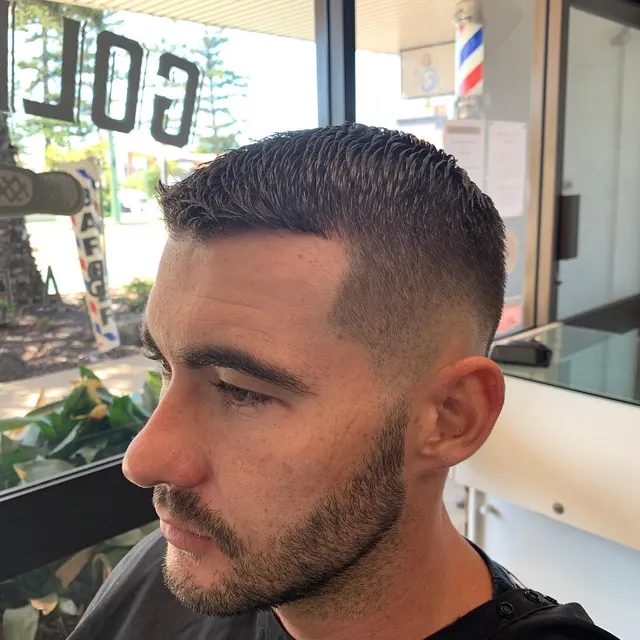 Sharp dark fade and beard at Golden Four